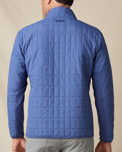 Rear view of the Big Sky Quilted Jacket in Moonlight, showing the all-over quilted construction and embroidered logo below the collar.