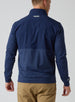 Men's Harding Hybrid Quarter Zip in New Indigo, back view on male model showing embroidered logo at center back neck and dual-fabric paneling
