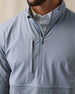 Men's Harding Hybrid Quarter Zip in Storm, close up detailed view of chest featuring a solid steel grey upper body with heathered charcoal grey lower body and sleeves, chest zip pocket and quarter zip detail