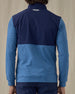 Men's Harding Hybrid Quarter Zip in Bering, back view on model featuring a navy performance upper back with a heathered blue fleece lower body and sleeves with the Straight Down logo embroidered at the upper back, worn with navy pants