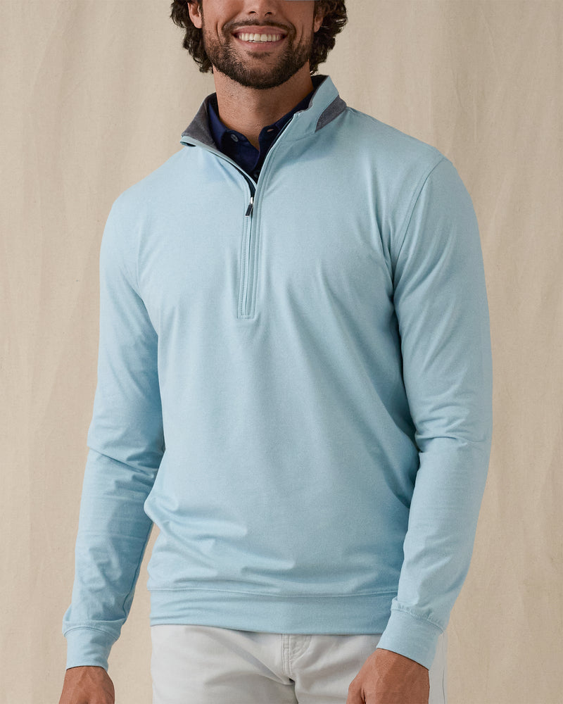Men's Cimarron Quarter Zip in Delphinium, front view on male model showcasing soft sky blue body with grey heathered collar and quarter zip, layered over a navy polo against a neutral backdrop