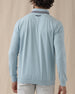 Men's Cimarron Quarter Zip in Delphinium, back view on male model showing embroidered logo at center back neck and grey heathered collar, paired with white pants