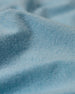 Men's Cimarron Quarter Zip in Delphinium, close-up fabric detail showing the soft sky blue color and heathered texture