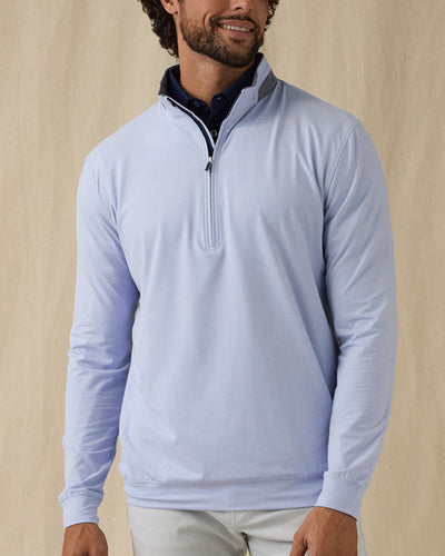 Men's Cimarron Quarter Zip in Lavender, front view on male model showcasing light blue-purple body with grey heathered collar and quarter zip, layered over a navy polo against a neutral backdrop