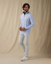 Men's Cimarron Quarter Zip in Lavender, full-length side view on male model styled with light grey pants and white golf shoes against a neutral linen backdrop