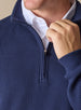 Men's Cambria Quarter Zip in New Indigo, close-up detail view of the quarter zip closure and ribbed knit fabric texture with navy interior collar, layered over a white collared shirt