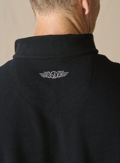 Men's Catalina Quarter Zip in Black, close-up detail view of the embroidered Straight Down winged logo at the back yoke against the black ribbed fabric