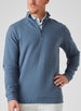 Men's Catalina Quarter Zip in Deep Sea, front on-model view featuring a slate blue ribbed fabric with a quarter zip closure, styled with white pants