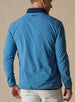 Men's Moonstone Quarter Zip in Petrol, back model view featuring a medium blue micro-fleece body with embroidered winged logo at the upper back yoke and navy contrast collar trim