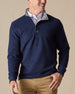 Men's Leucadia Quarter Snap Pullover in Indigo, front model view featuring a snap-button placket and gray contrast collar layered over a white button-down shirt, styled with khaki pants