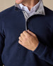 Men's Leucadia Quarter Snap Pullover in Indigo, close-up detail of snap-button placket featuring gray contrast inner collar layered over a white button-down shirt
