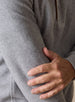 Men's Leucadia Quarter Snap Pullover in Light Charcoal, extreme close-up view highlighting the heather gray fleece fabric texture and quarter snap placket detail