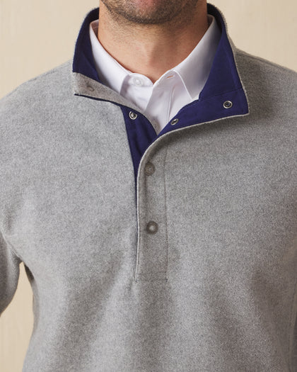 Men's Leucadia Quarter Snap Pullover in Heather, close-up front view on model highlighting the navy contrast inner collar and snap closure neckline detail