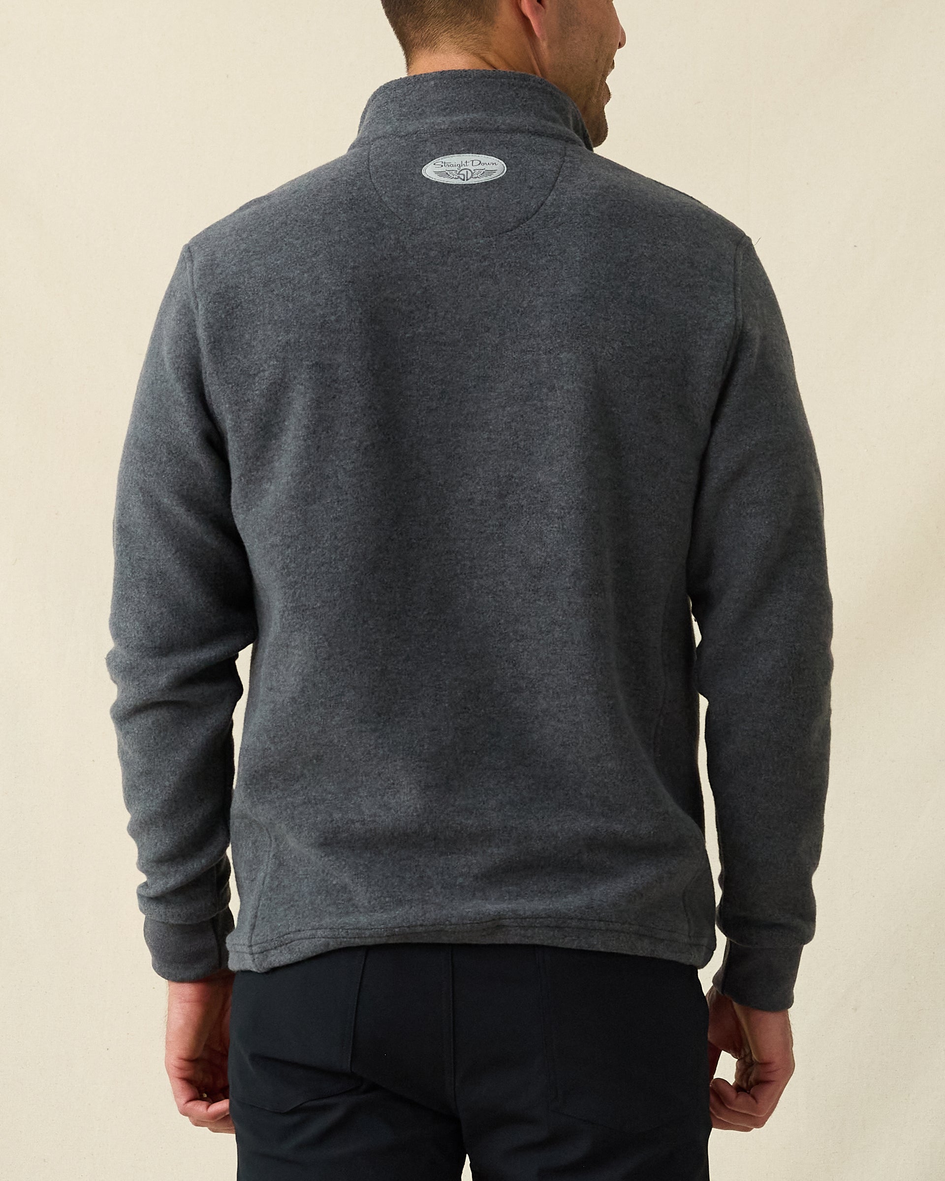 Men's Leucadia Quarter Snap Pullover in Charcoal, back view on model featuring the Straight Down logo at the upper back, paired with black pants