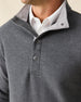 Men's Leucadia Quarter Snap Pullover in Charcoal, close-up front view on model highlighting the snap closure neckline detail layered over a white polo collar