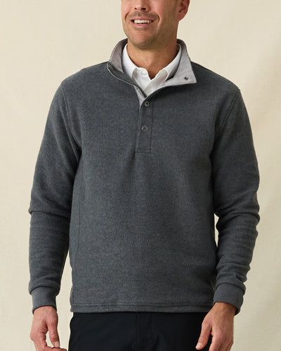 Men's Leucadia Quarter Snap Pullover in Charcoal, front view on model featuring a charcoal heather fleece with snap closure neckline, paired with black pants