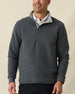 Men's Leucadia Quarter Snap Pullover in Charcoal, front view on model featuring a charcoal heather fleece with snap closure neckline, paired with black pants