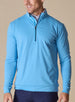 Men's Patron Quarter Zip in Niagara, front view in solid light blue with a navy quarter zip closure, paired with navy pants