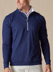 Mens Patron Quarter Zip in new indigo dark blue, front view on model styled with white polo