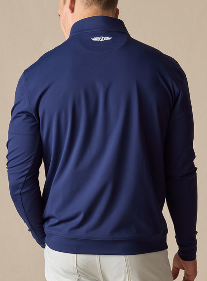 Mens Patron Quarter Zip in new indigo dark blue, back view on model
