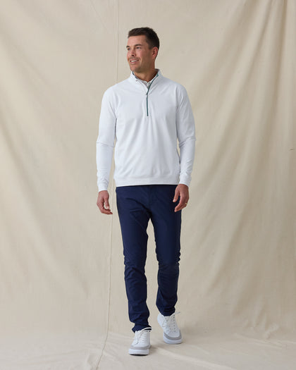 Men's Patron Quarter Zip in White Sage, full length front view on model featuring a white base with a quarter zip closure and sage contrast zipper and collar lining detail, paired with navy pants and white shoes