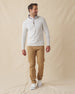 Men's Montecito Quarter Zip in Heather, full length front view on model featuring a light heather gray ribbed knit with silver quarter zip, paired with tan pants and white shoes