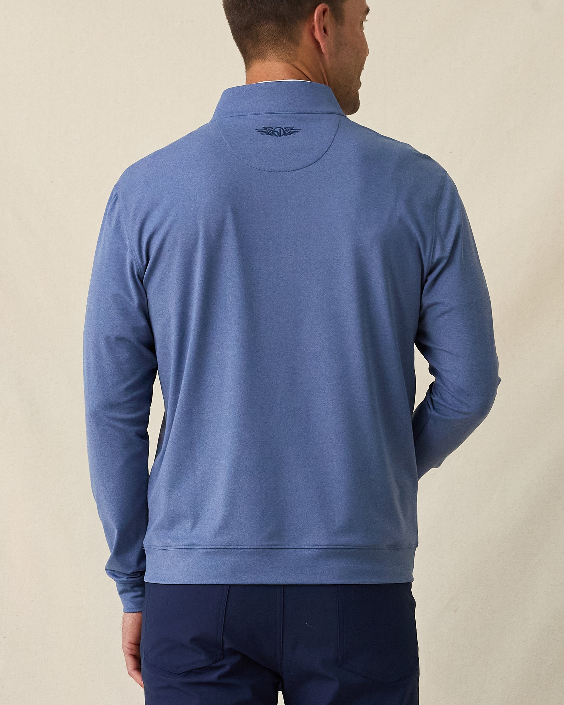 Men's Tiburon Quarter Zip in Moonlight, back view on model featuring a heathered jersey with tonal Straight Down logo embroidered at center back neck, paired with navy pants