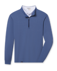 Blue buttery soft midweight quarter zip pullover layered with a white polo visible at the neckline