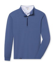 Blue buttery soft midweight quarter zip pullover layered with a white polo visible at the neckline