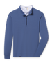 Blue buttery soft midweight quarter zip pullover layered with a white polo visible at the neckline