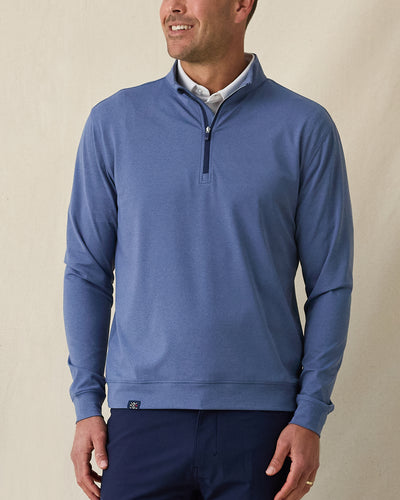Men's Tiburon Quarter Zip in Moonlight, front view on model featuring a heathered jersey with navy quarter zip placket, layered over a white polo, paired with navy pants