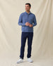 Men's Tiburon Quarter Zip in Moonlight, full length front view on model featuring a heathered jersey with navy quarter zip placket, layered over a white polo, paired with navy pants and white shoes