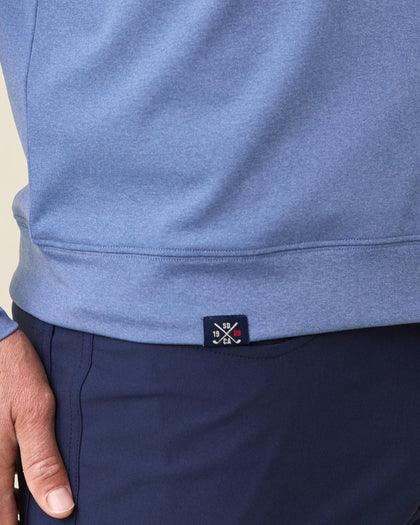 Men's Tiburon Quarter Zip in Moonlight, close-up hem view on model highlighting the ribbed hem band and Straight Down CA 1989 woven label detail