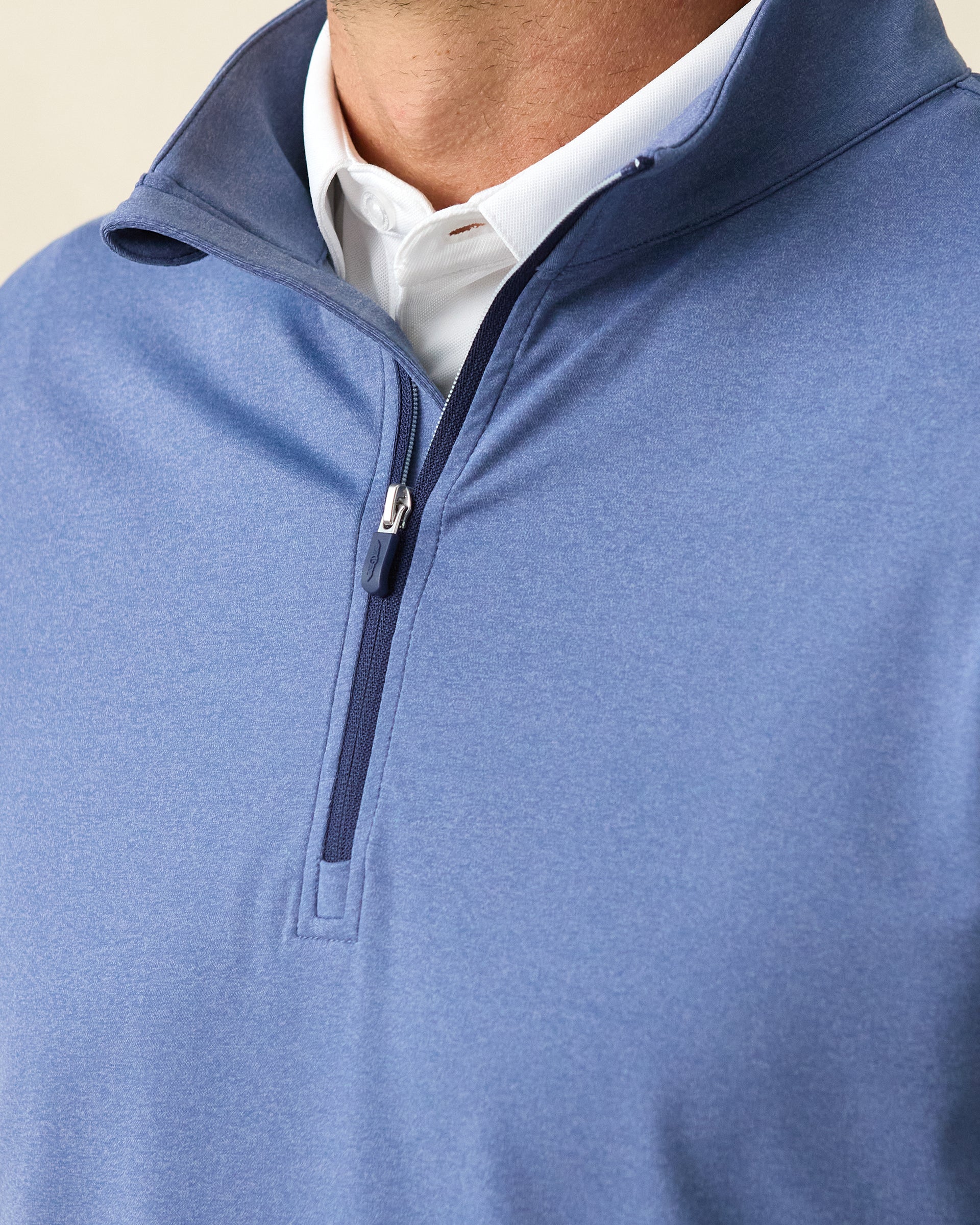 Men's Tiburon Quarter Zip in Moonlight, close-up front view on model highlighting the navy quarter zip placket and white polo collar visible at neckline