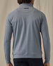 Men's Tiburon Quarter Zip in Storm, back view on model featuring a heathered gray solid fabric with Straight Down logo embroidered at the upper back, paired with black pants