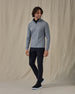 Men's Tiburon Quarter Zip in Storm, full-length side view on model featuring a heathered gray solid fabric with a quarter zip placket, paired with black pants and black shoes