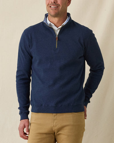 Men's Burnside 2.0 Quarter Zip in New Indigo, front view on model featuring a heathered fleece with light blue collar lining and brass zipper with leather pull tab, layered over a white polo, paired with khaki pants