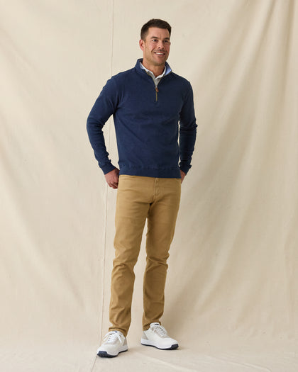 Men's Burnside 2.0 Quarter Zip in New Indigo, full length front view on model featuring a heathered fleece with light blue collar lining and brass zipper, layered over a white polo, paired with khaki pants and white shoes
