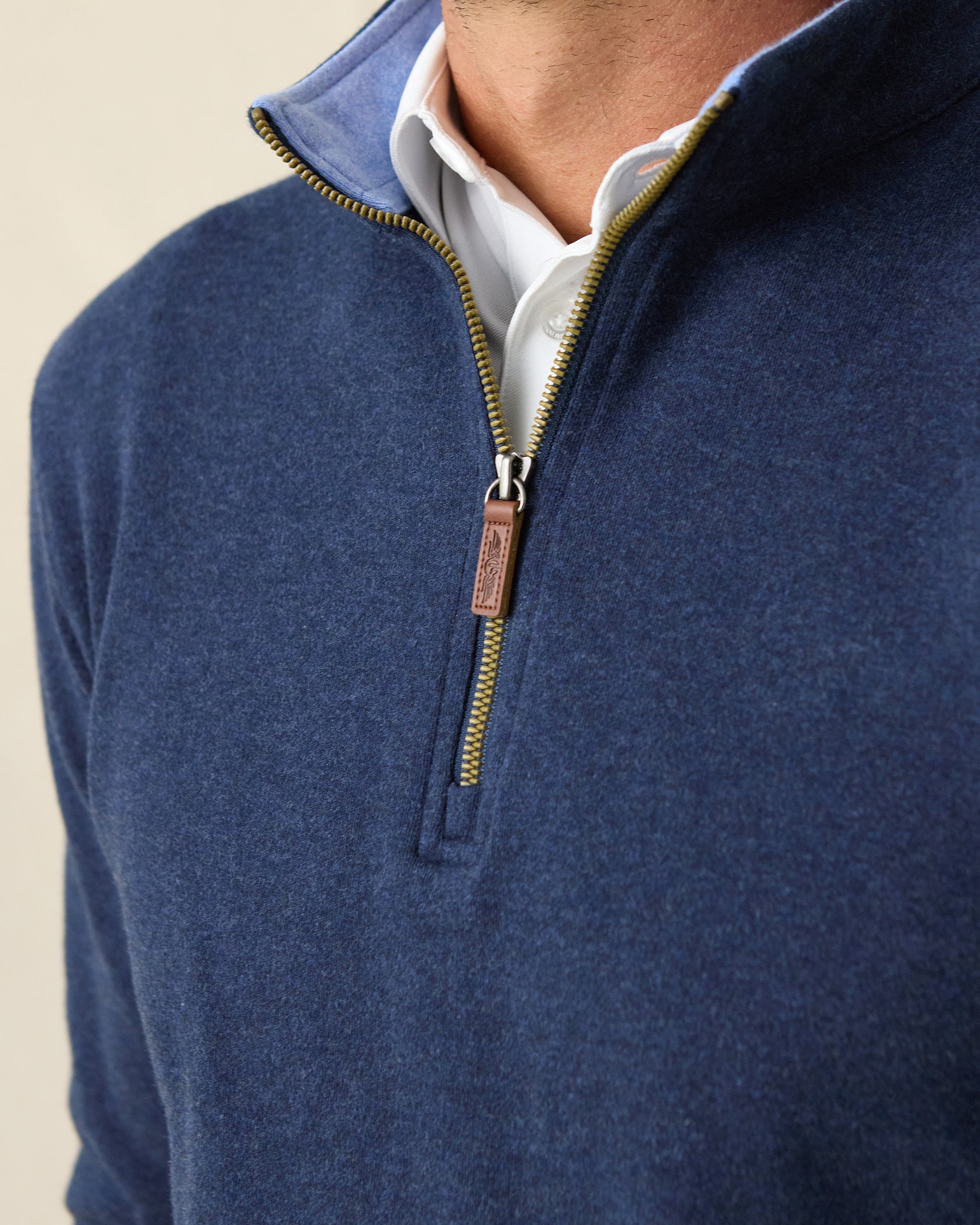 Men's Burnside 2.0 Quarter Zip in New Indigo, close-up front view on model highlighting the light blue collar lining, brass zipper and leather Straight Down logo pull tab detail