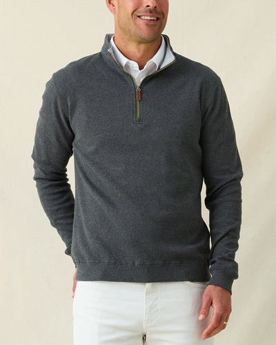 Men's Burnside 2.0 Quarter Zip in Charcoal, front view on model featuring a charcoal heather fleece with brass quarter zip and leather zip pull, paired with white pants