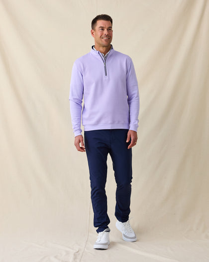 Men's Cardiff Quarter Zip in Violet, full length front view on model featuring a bubble knit texture with navy interior lining and silver zipper, layered over a white polo, paired with navy pants and white shoes