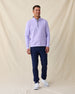 Men's Cardiff Quarter Zip in Violet, full length front view on model featuring a bubble knit texture with navy interior lining and silver zipper, layered over a white polo, paired with navy pants and white shoes