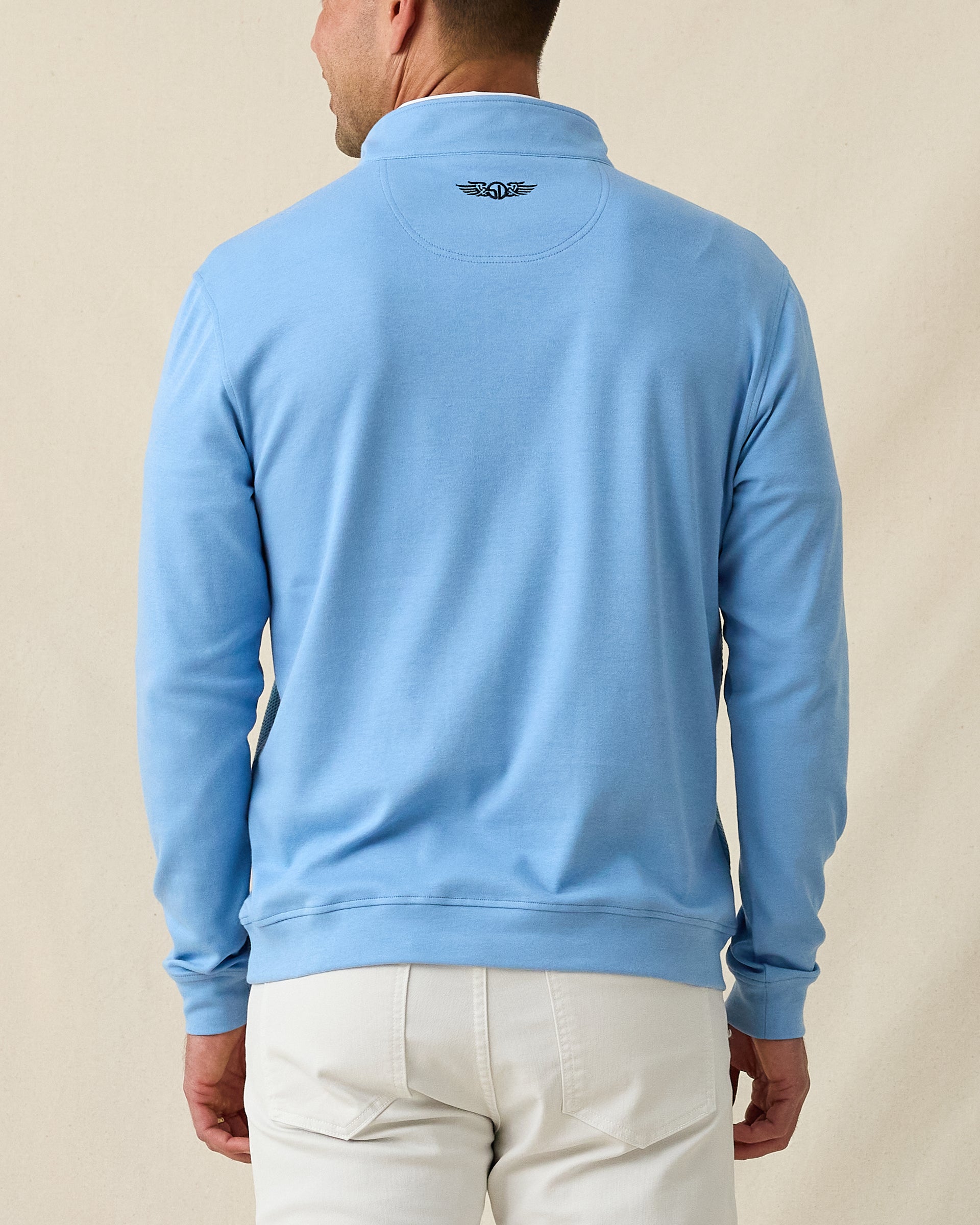 Men's Cardiff Quarter Zip in Coastal, back model view featuring a medium blue long sleeve quarter zip pullover with an embroidered Straight Down logo at the back collar