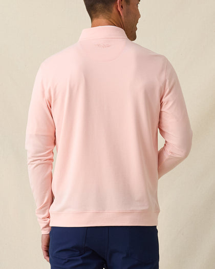 Men's Palmetto Quarter Zip in Spritz, back model view featuring a light pink long sleeve quarter zip pullover with a tonal embroidered Straight Down logo at the back collar, styled with navy pants