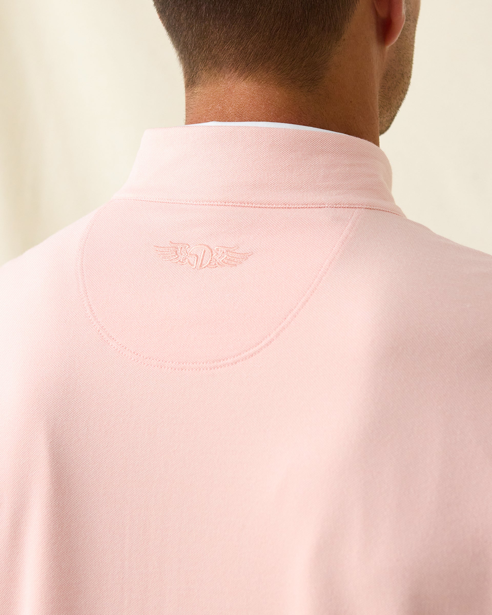 Men's Palmetto Quarter Zip in Spritz, back collar detail view featuring a tonal embroidered Straight Down logo on a light pink textured performance fabric