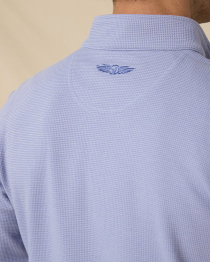Close-up of the textured mini-grid fabric and embroidered Straight Down logo below the back collar.
