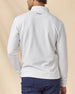 Rear view of the white Warren Quarter Zip, showing the textured fabric and embroidered logo below the back collar.