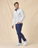 Model wearing the white Warren Quarter Zip with navy pants and white sneakers.