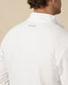 Close-up of the Warren Quarter Zip highlighting the textured white fabric, navy collar lining, and quarter-zip closure.