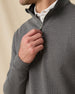 Close-up of the Warren Quarter Zip in Black showing the mini-grid textured knit, stand collar, and metal zipper detail.